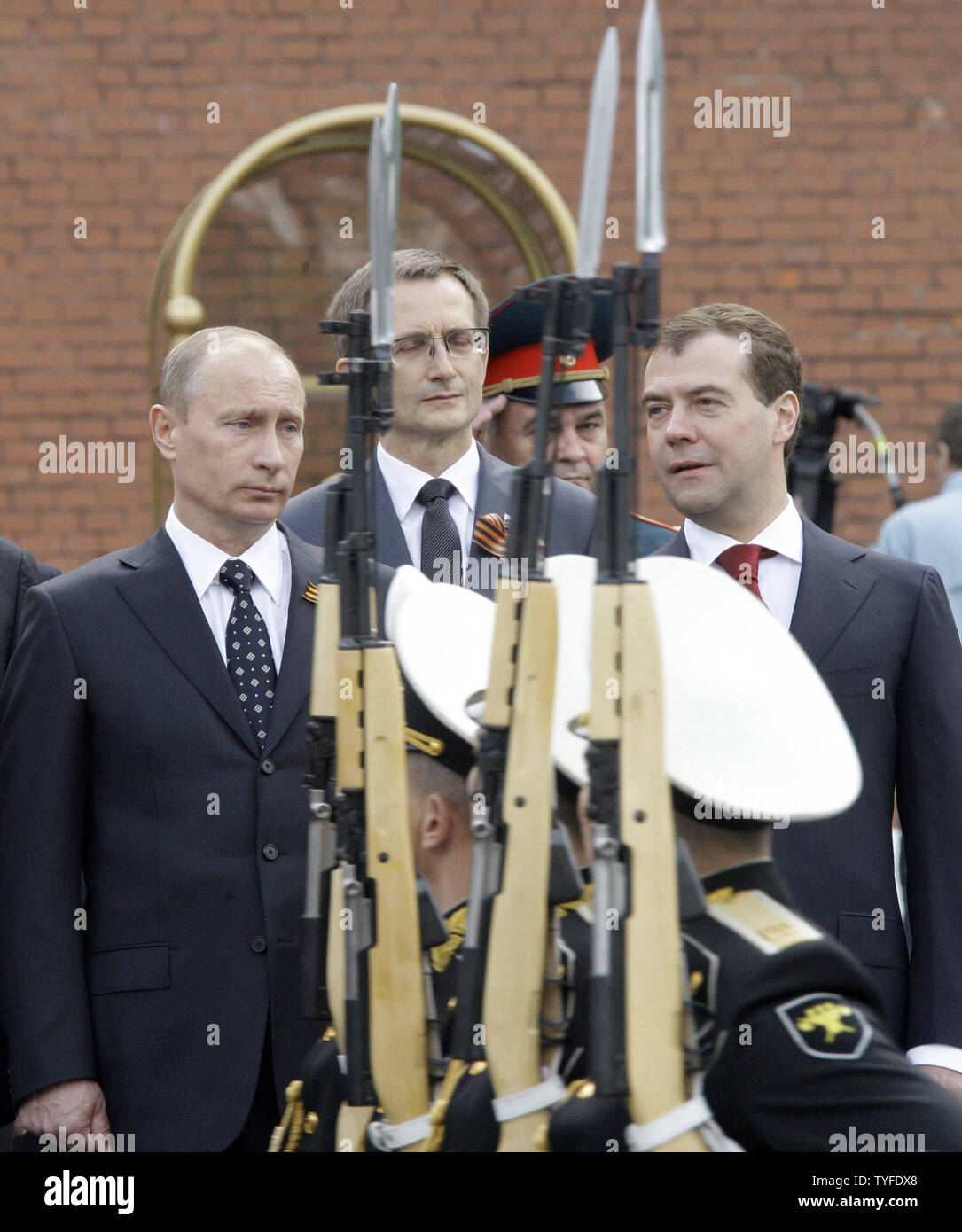 Russian President Dmitry Medvedev (R) and Prime Minister Vladimir Putin (L) review the troops during a wreath laying ceremony at the Tomb of the Unknown Soldier in Moscow on May 8, 2009 on the eve of the Victory Day. On Saturday, May 9 Russia will celebrate the 64th anniversary of the World War Two victory over Nazi Germany. (UPI Photo/Anatoli Zhdanov) Stock Photo