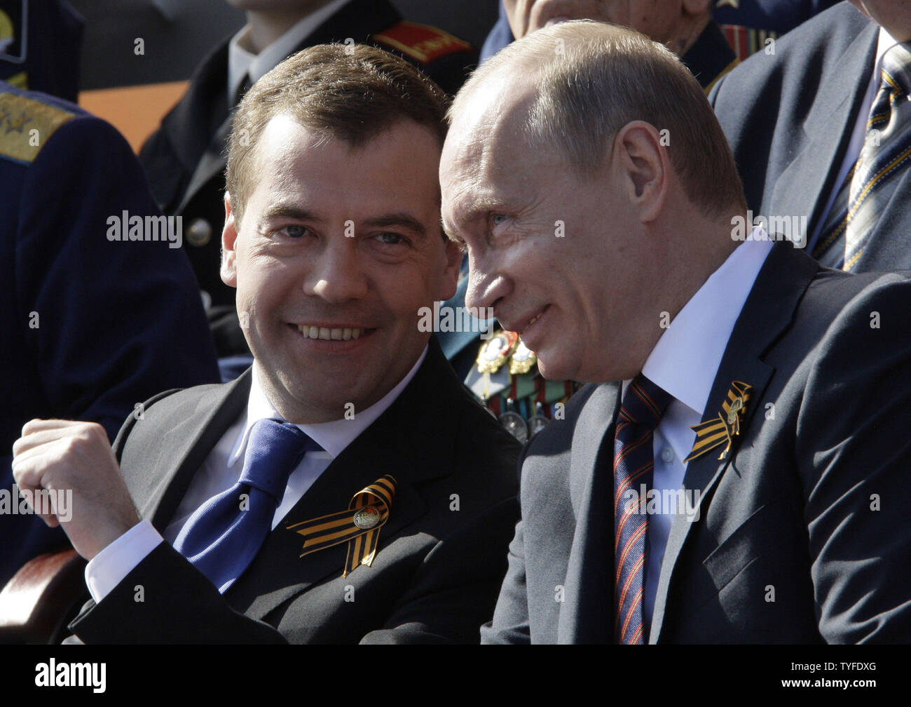 Russian President Dmitry Medvedev (L) and Prime Minister Vladimir Putin chat during the Victory Day military parade in Red Square in Moscow on May 9, 2009. Today Russia celebrates the 64th anniversary of the World War Two victory over Nazi Germany. (UPI Photo/Anatoli Zhdanov) Stock Photo