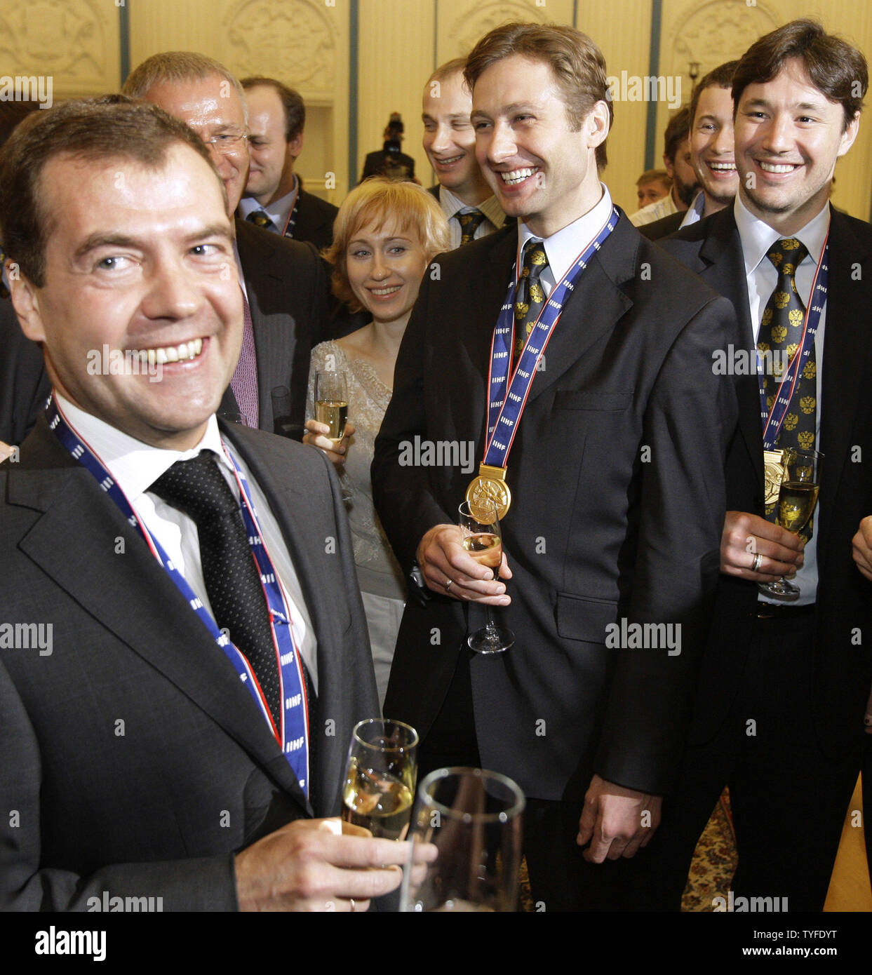 Russian President Dmitry Medvedev (L) with player Iliya Kovalchuk (R) and captain Alexei Morozov (C) toast during a celebration in the Kremlin in Moscow on May 12, 2009. In the final match on Sunday Russia beat Canada 2-1 and won the gold-medal of the ice hockey world championships. (UPI Photo/Anatoli Zhdanov) Stock Photo