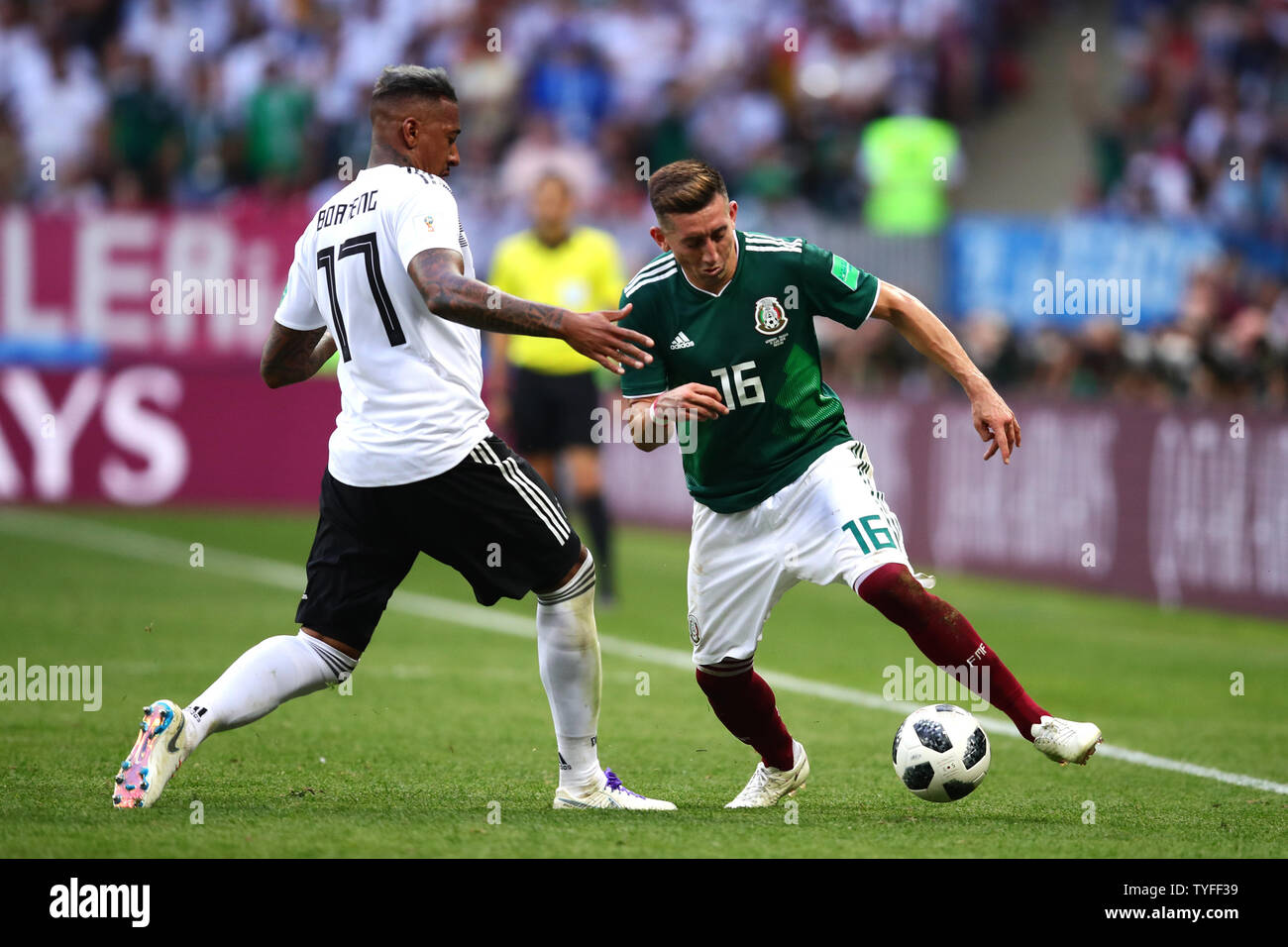 Hector Herrera (R) of Mexico is challenged by Jerome Boateng of Germany during the 2018 FIFA World Cup Group F match at the Luzhniki Stadium in Moscow, Russia on June 17, 2018. Photo by Chris Brunskill/UPI Stock Photo