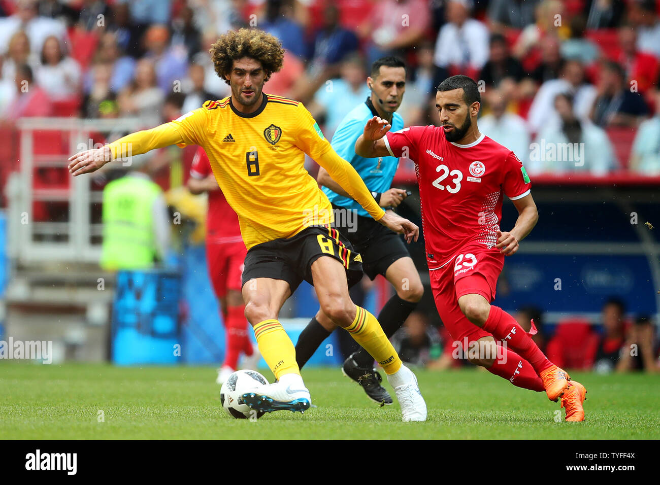 Marouane Fellaini of Belgium (L) is challenged by Naim Sliti of Tunisia during the 2018 FIFA World Cup Group G match at the Spartak Stadium in Moscow, Russia on June 23, 2018. Belgium defeated Tunisia 5-2.     Photo by Chris Brunskill/UPI Stock Photo