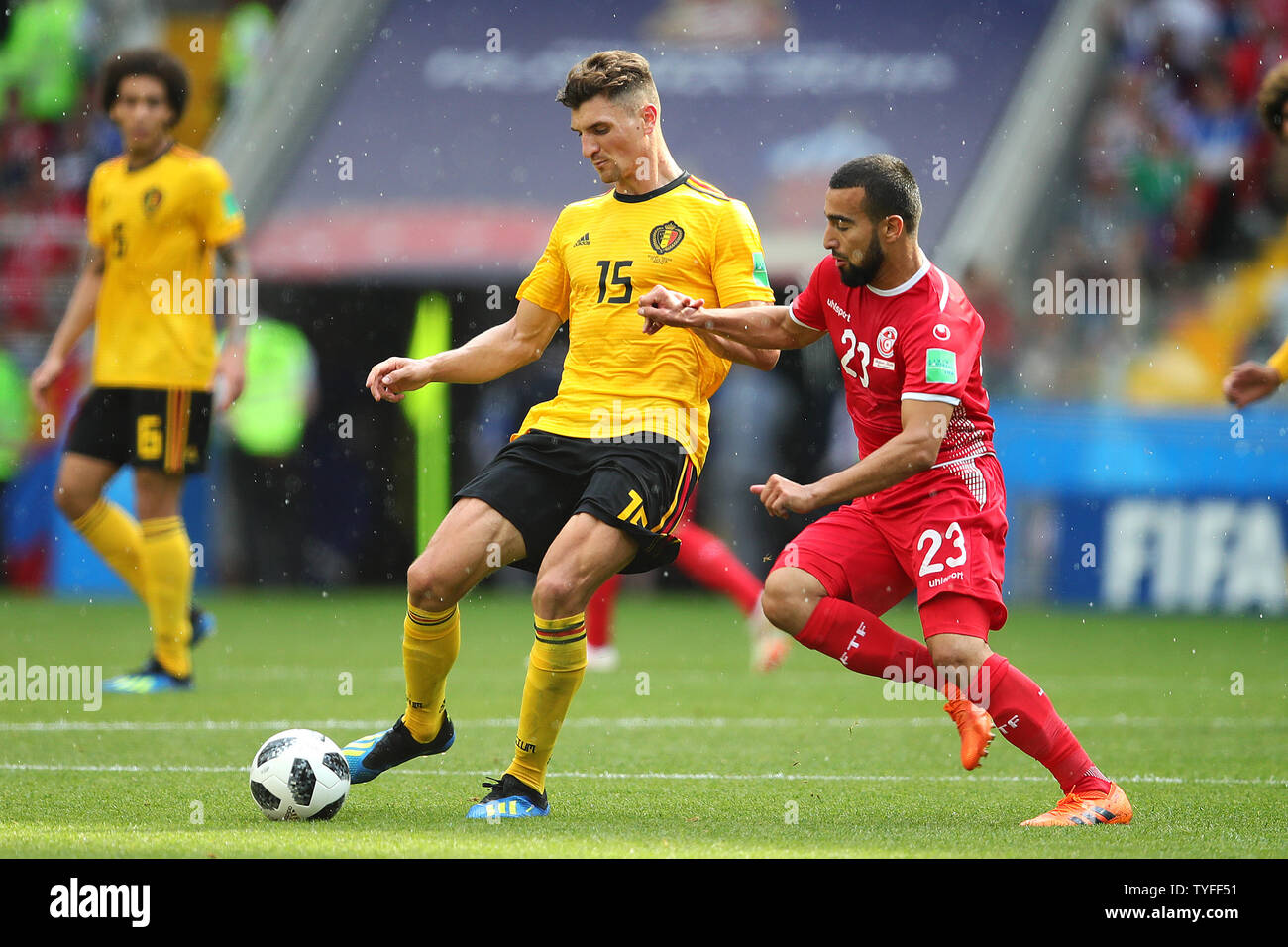 Thomas Meunier of Belgium (L) is challenged by Naim Sliti of Tunisia during the 2018 FIFA World Cup Group G match at the Spartak Stadium in Moscow, Russia on June 23, 2018. Belgium defeated Tunisia 5-2.   Photo by Chris Brunskill/UPI Stock Photo