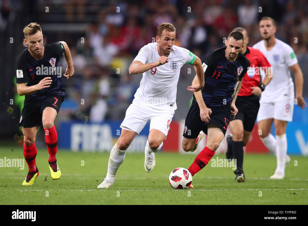 Marcelo Brozovic (R) of Croatia competes for the ball with Harry Kane (C) of England during the 2018 FIFA World Cup semi-final match at Luzhniki Stadium in Moscow, Russia on July 11, 2018. Croatia beat England 2-1 to qualify for the final. Photo by Chris Brunskill/UPI Stock Photo