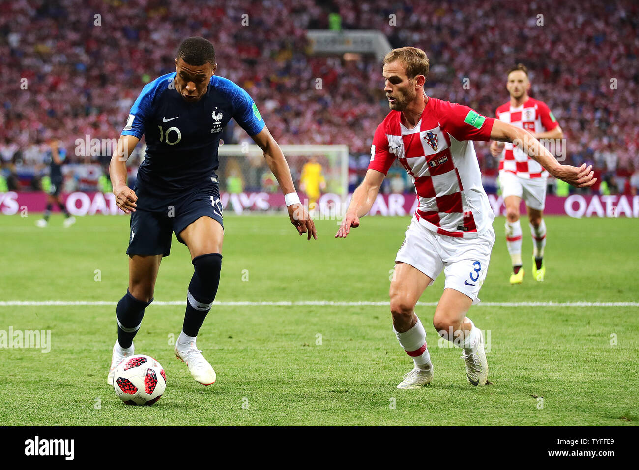 Kylian Mbappe of France runs at Ivan Strinic of Croatia during the 2018 FIFA World Cup final match at Luzhniki Stadium in Moscow, Russia on July 15, 2018. France beat Croatia 4-2. Photo by Chris Brunskill/UPI Stock Photo