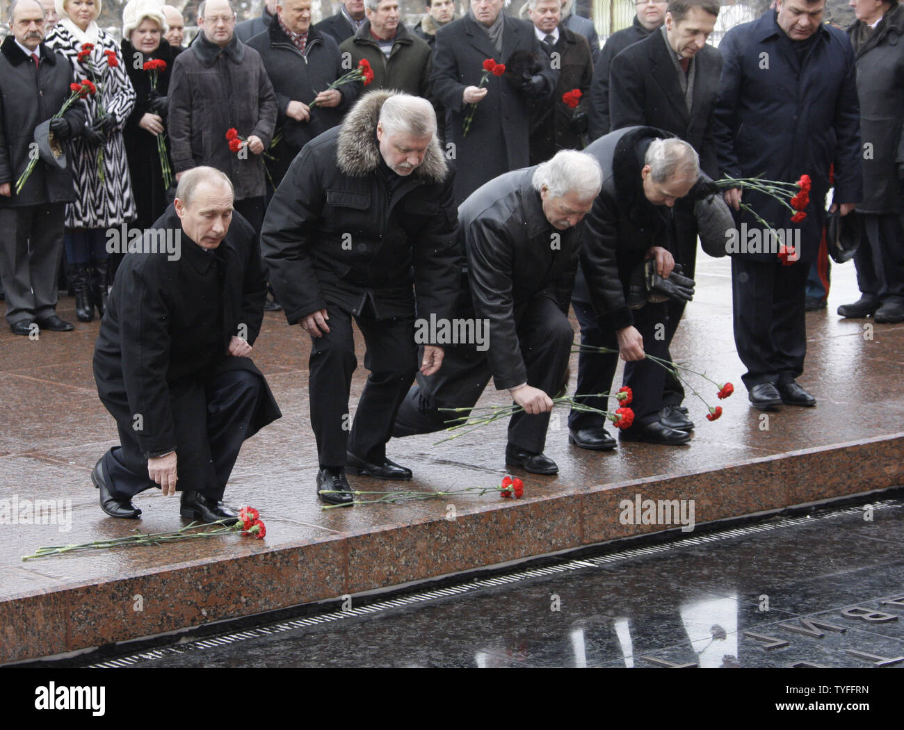 (L-R) Russian Prime Minister Vladimir Putin, Federation Council speaker Sergei Mironov, Parliament speaker  Boris Gryzlov and the Constitutional Court chairman Valery Zorkin take part in the ceremony to light the eternal flame at the Tomb of the Unknown Soldier outside the Kremlin in Moscow on February 23, 2010. The eternal flame was temporarily moved for three months during constructions of the Tomb of the Unknown Soldier and relighted today to to mark the Defender of the Fatherland Day in Russia. UPI/Alexander Natin Stock Photo