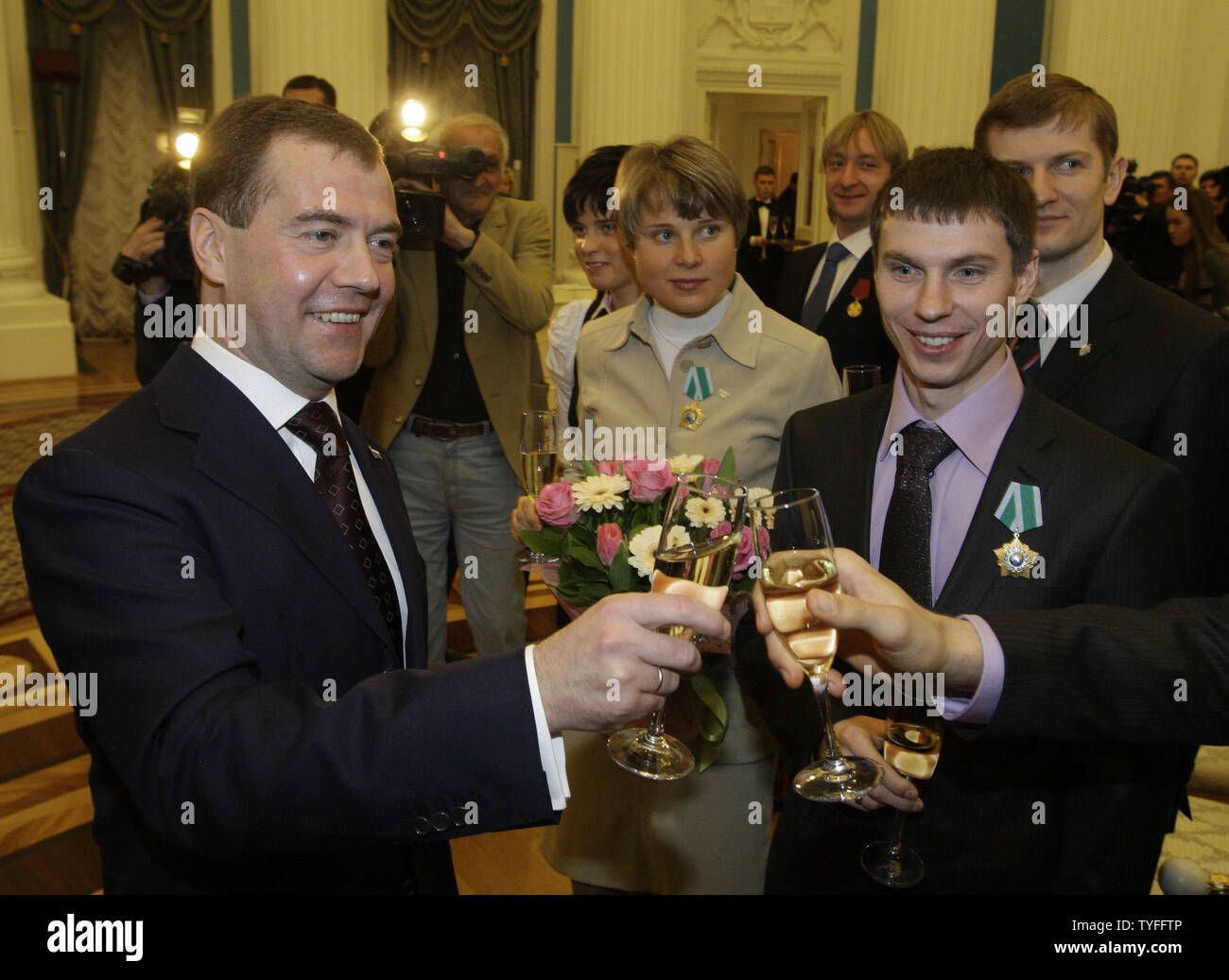 Russian President Dmitry Medvedev (L) toasts with national athletes who won medals at Winter Olympic Games in Vancouver during a reception in the Kremlin in Moscow on March 15, 2010. UPI/Alex Natin Stock Photo