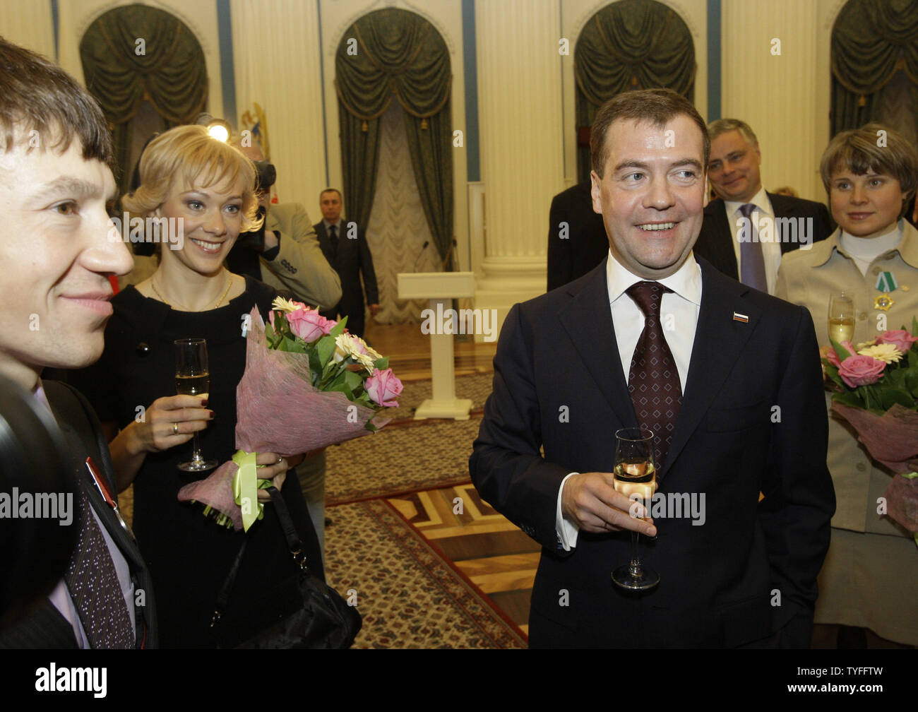 Russian President Dmitry Medvedev (R) toasts with national athletes who won medals at Winter Olympic Games in Vancouver during a reception in the Kremlin in Moscow on March 15, 2010. UPI/Alex Natin Stock Photo