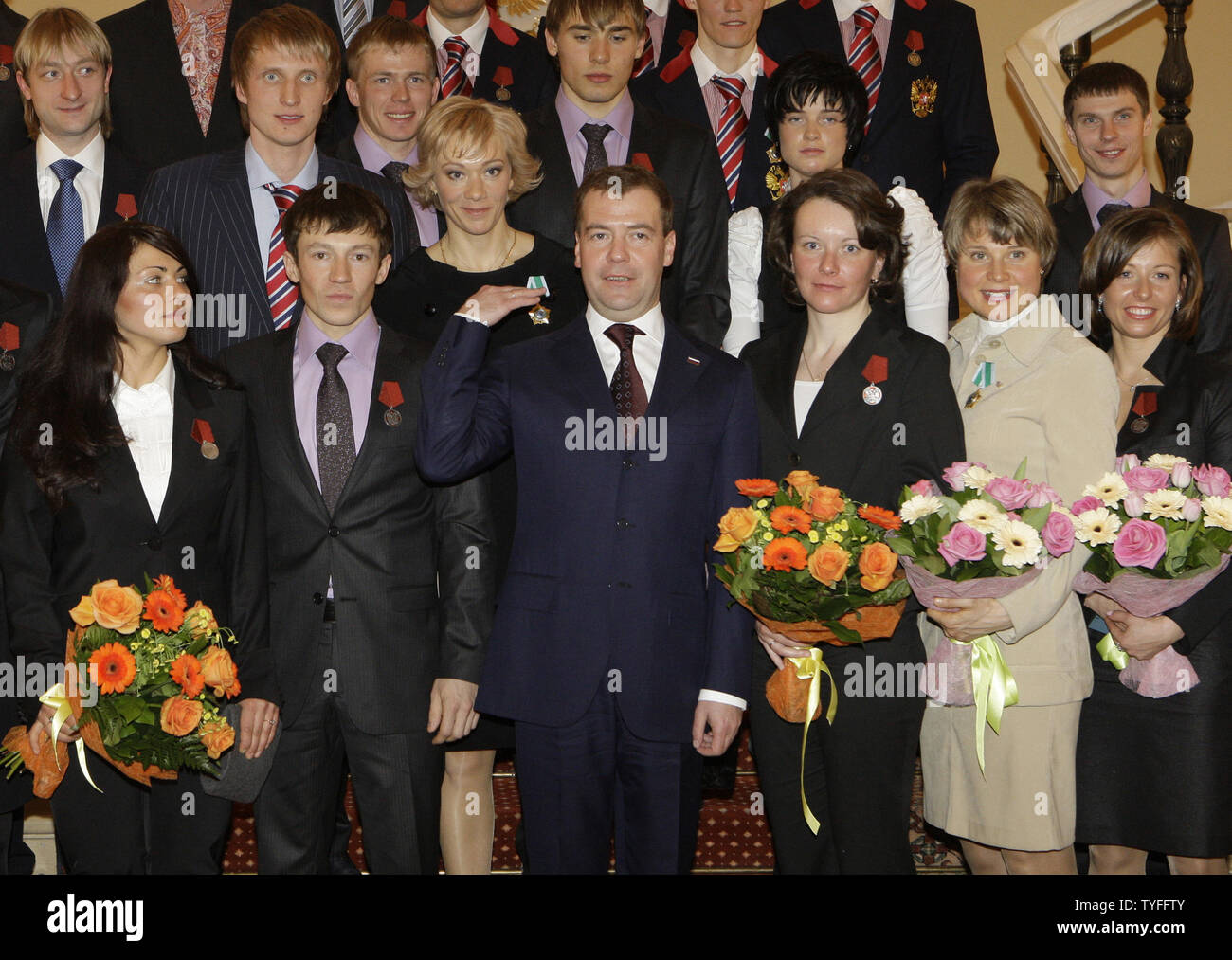 Russian President Dmitry Medvedev (C) poses for a group photo with national team athletes who won medals at the Winter Olympic Games in Vancouver during a reception in the Kremlin in Moscow on March 15, 2010. UPI/Alex Natin Stock Photo