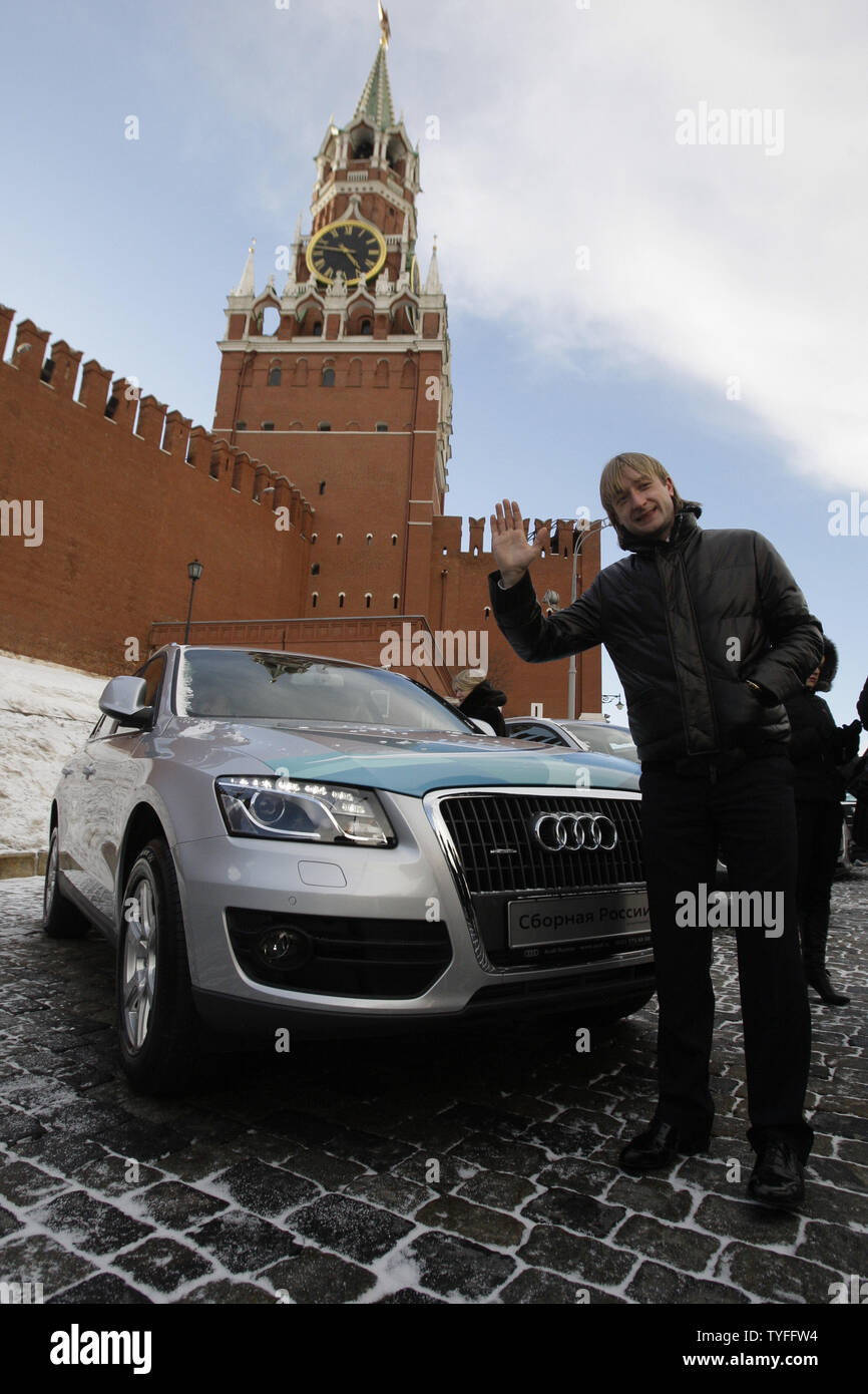 Russian figure skater Yevgeny Plushenko who won silver medal at Winter Olympic Games in Vancouver waves at his new Audi Q5 crossover after a reception in honor of the national Olympic team in the Kremlin in Moscow on March 15, 2010. Russian government awarded national sportsmen Audi Q7 ($100K) for the gold, Audi Q5 ($60k) for the silver and Audi A4 ($50K) for the bronze medals. UPI/Alex Hatin Stock Photo