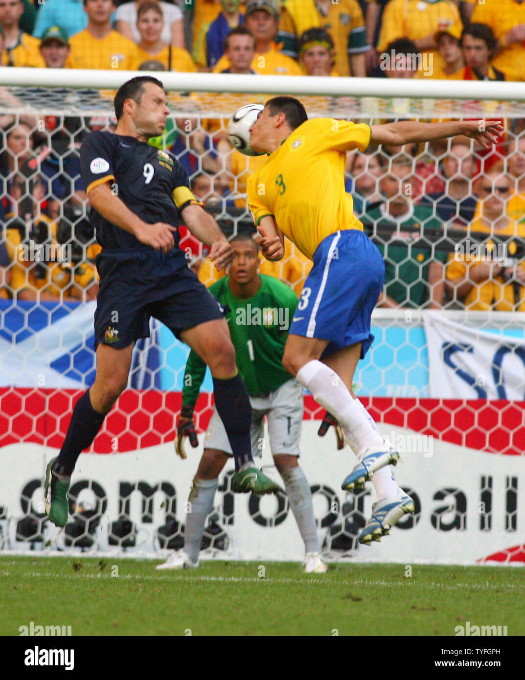 Lucio (3) from Brazil tries to make a headed goal and Australia's Mark Viduka (9) tries to prevent this in World Cup soccer action in Munich, Germany on June 18, 2006. Brazil defeated Australia 2-0.  (UPI Photo/Arthur Thill) Stock Photo