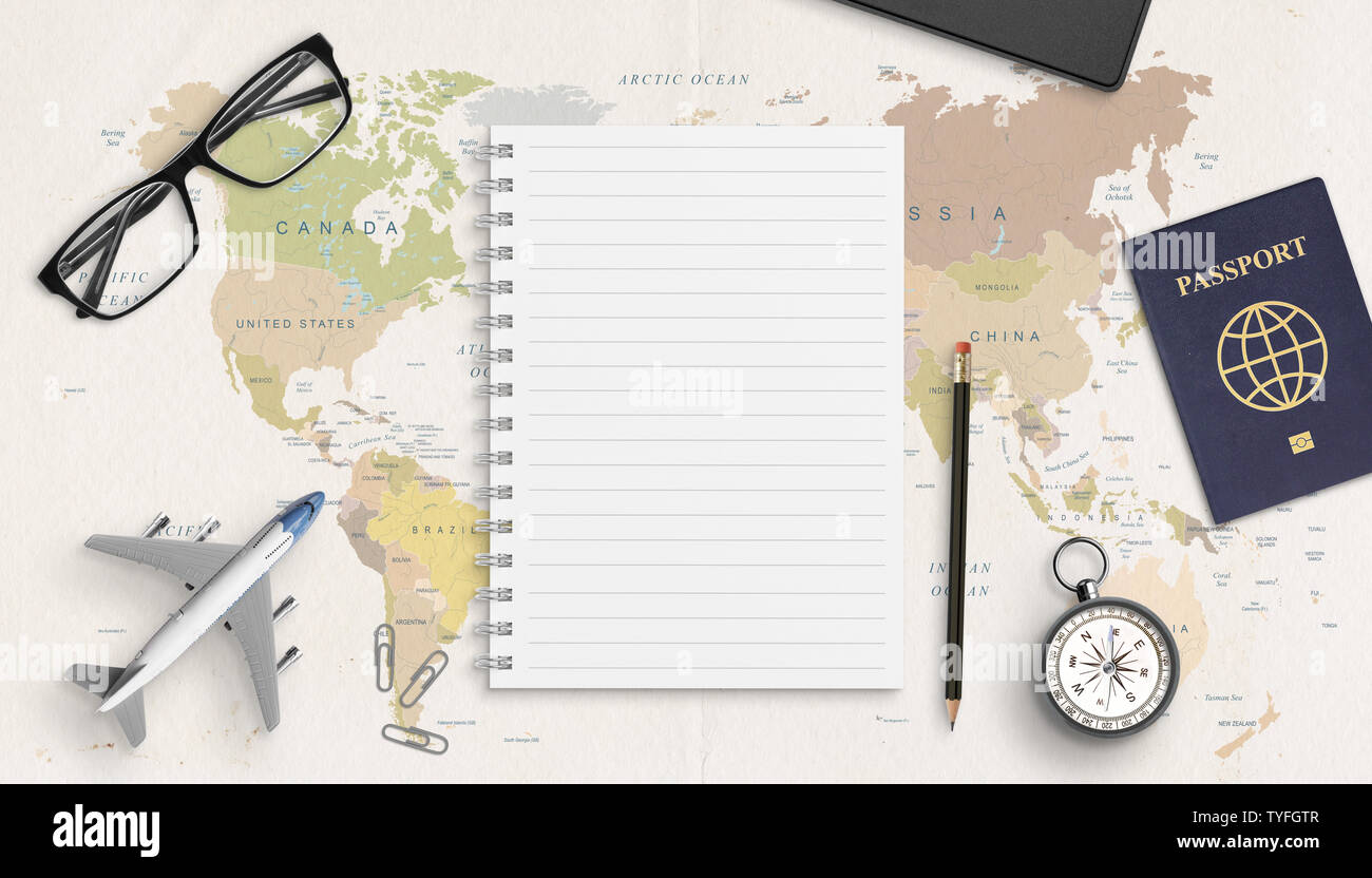 Empty pad mockup for list of necessary things for travel.  Concept travel composition on world map. Top view, flat lay. Stock Photo