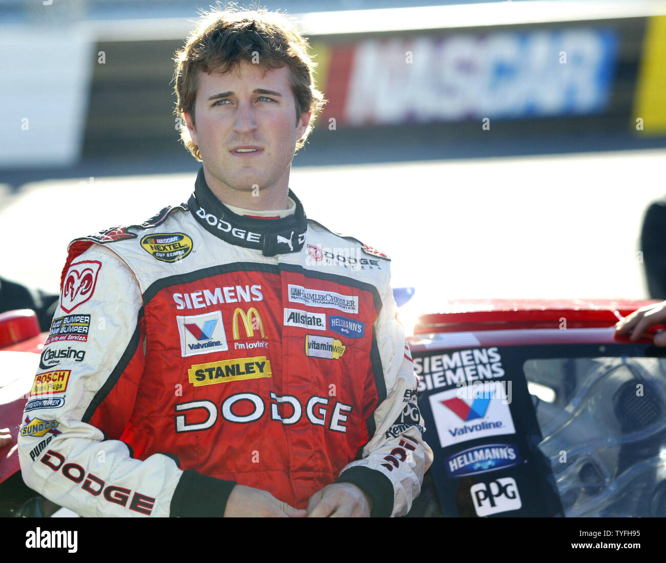 Race car driver Kasey Kahne stands by his Dodge Dealers/UAW Dodge