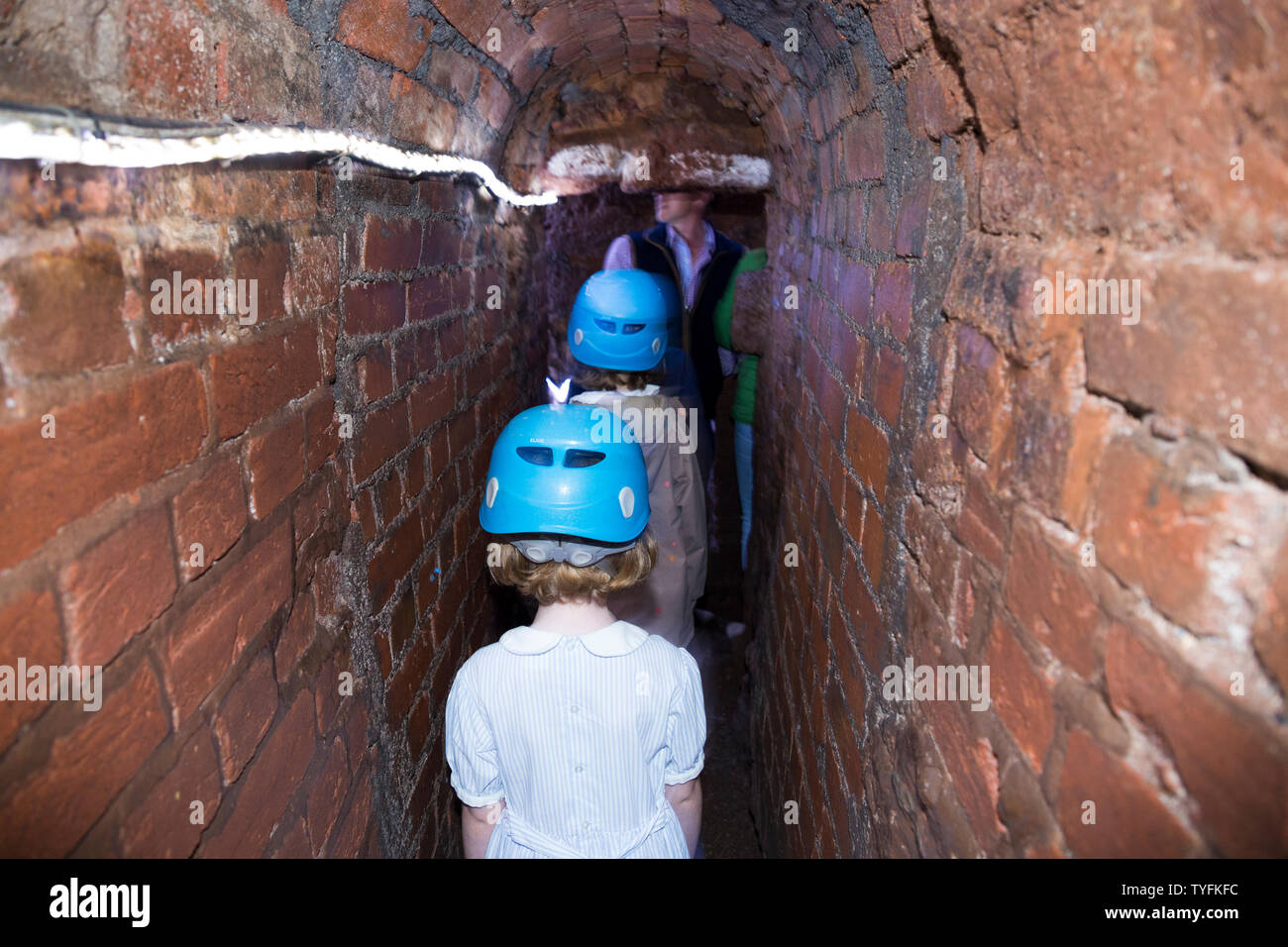 Family including children / kid / kids and young girl follow a group