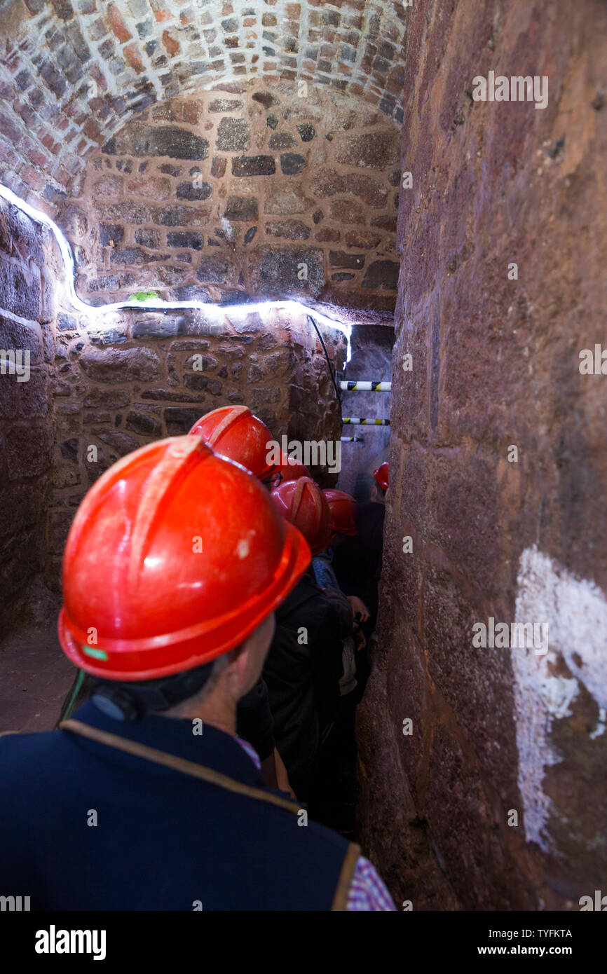 Tour group follow the guide around Exeter's underground passages and