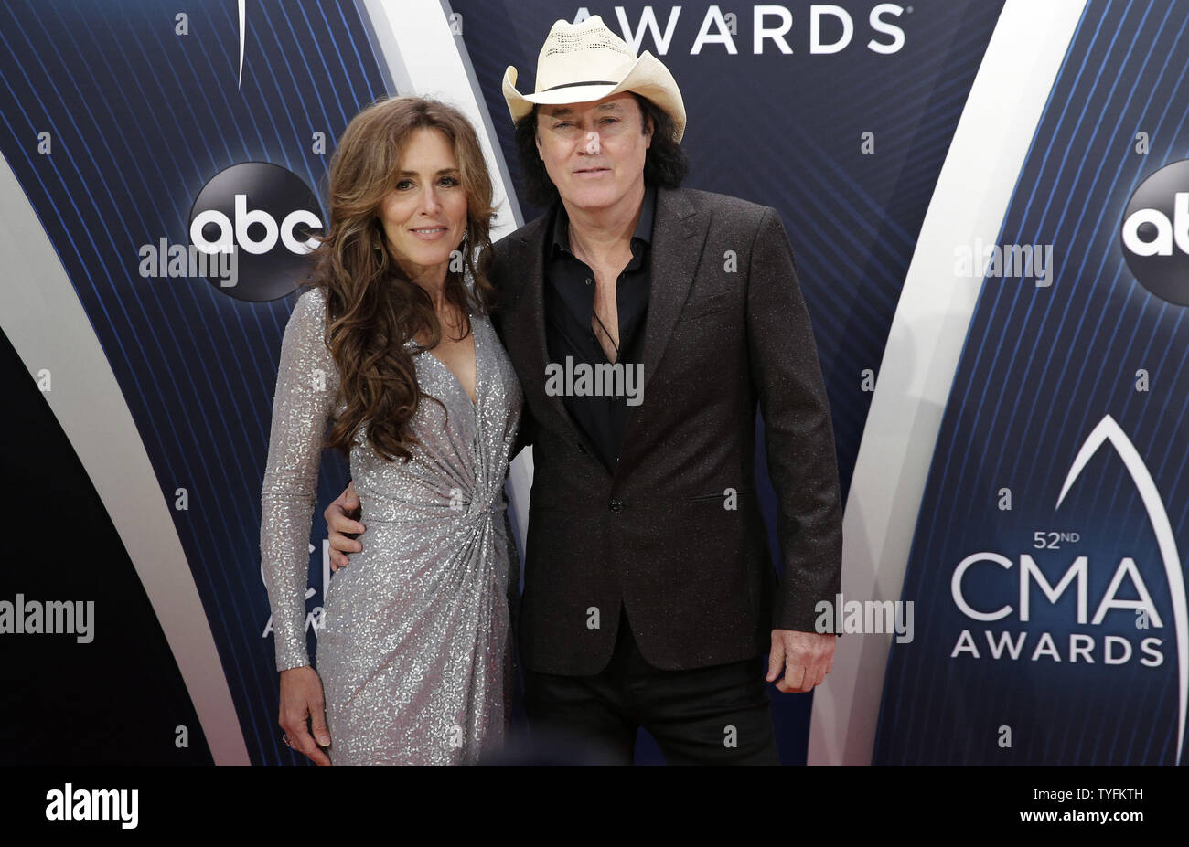 David Lee Murphy and guest arrive on the red carpet at the 52nd Annual  Country Music