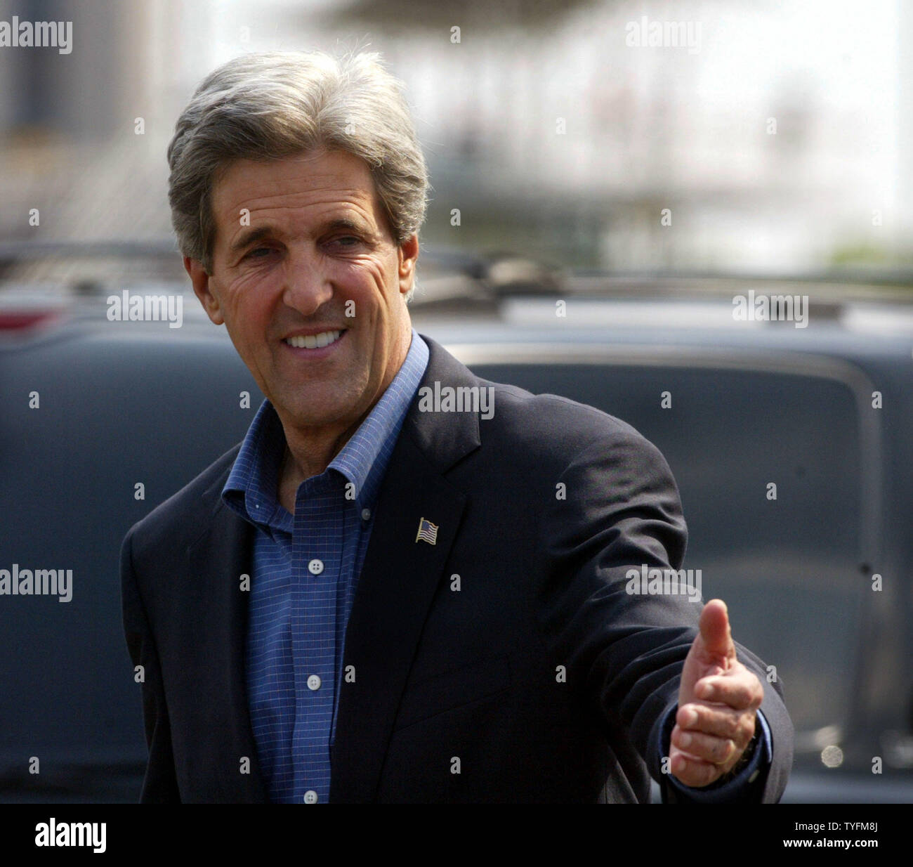 Massachusetts Senator John Kerry greets supporters as he arrives at the