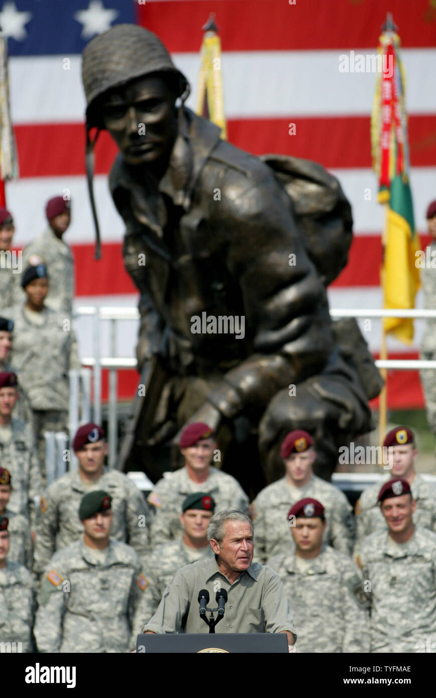 Standing beneath the “Iron Mike” statue, President George Bush speaks