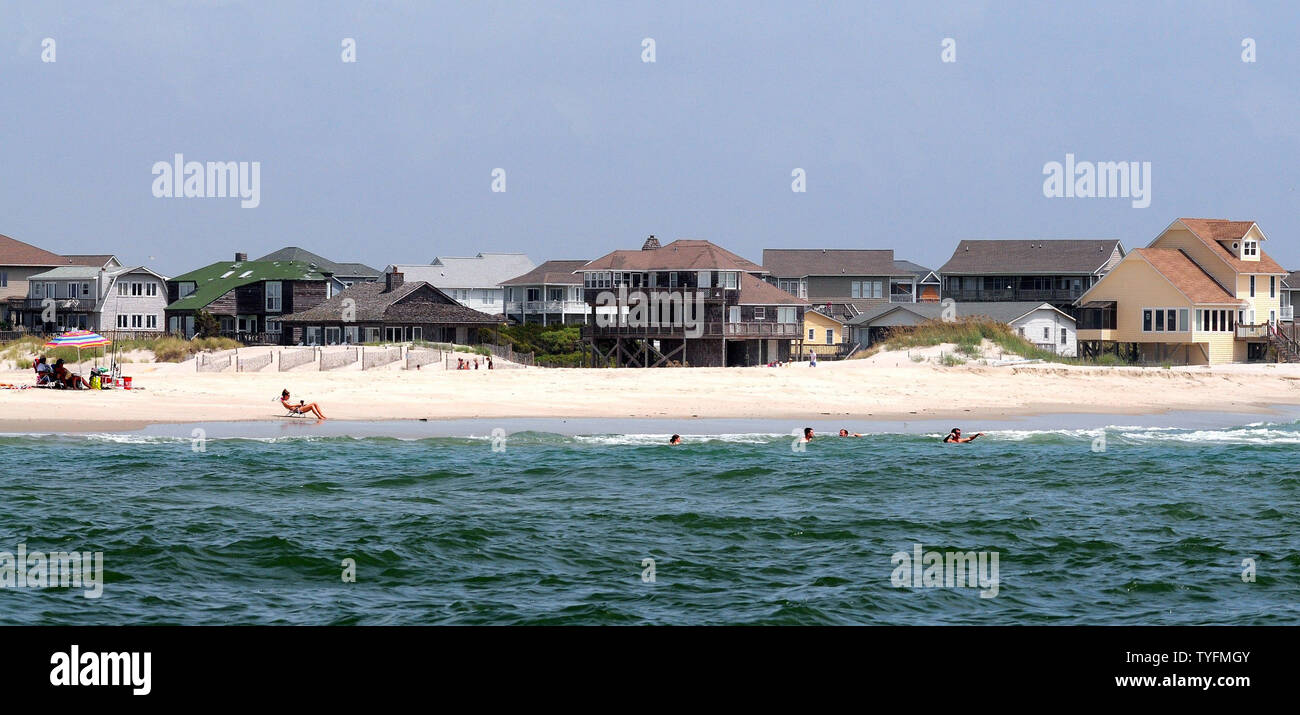 Residents and tourists on Emerald Isle, North Carolina, enjoy one last day  of beautiful weather before Hurricane Irene's arrival on August 25, 2011.  Irene is a category 3 hurricane that is expected