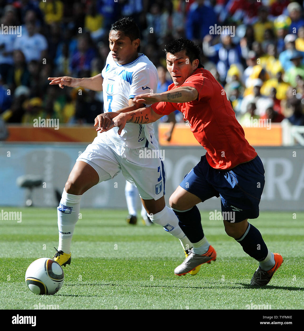 Ramon Nunez of Honduras and Gary Medel of Chile during the Group H match at the Mbombela Stadium in Nelspruit, South Africa on June 16, 2010. UPI/Chris Brunskill Stock Photo