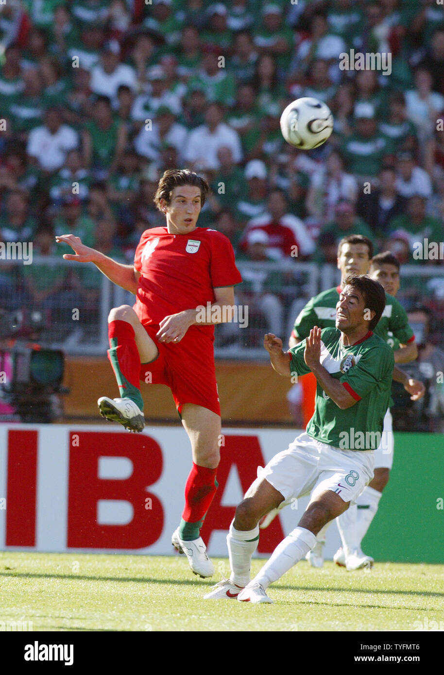 Irans Andranik Teymourian (14) in a fight with Mexican Pavel Pardo (8) in a World Cup match in Nuernberg on June 11, 2006. Mexico won 3-1.  (UPI  Photo/Arthur Thill) Stock Photo
