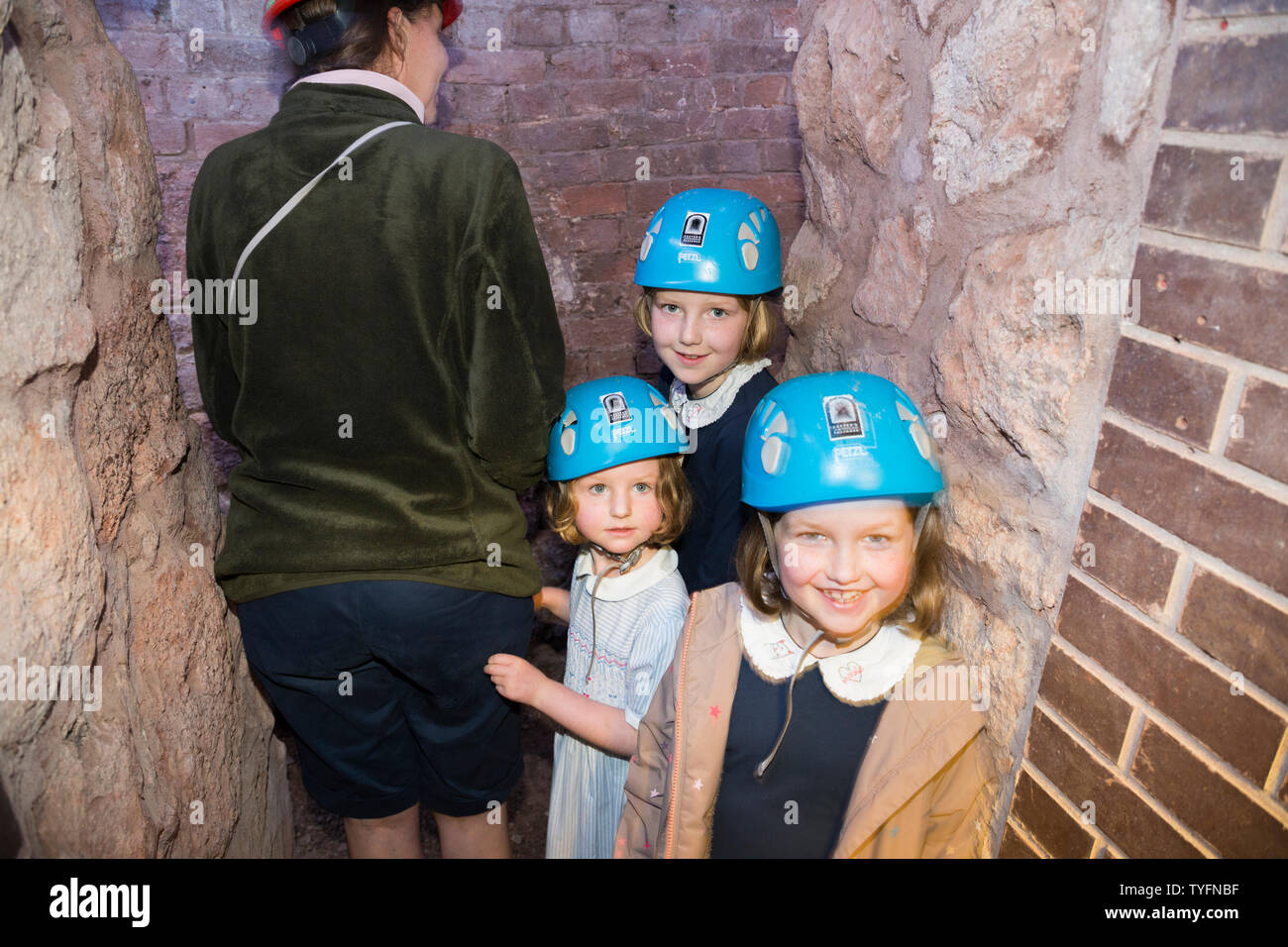 Mother / mum and children kids in Exeter's underground passages and