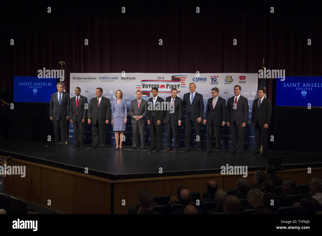 Republican presidential candidates, from left to right, Jeb Bush, Ben Carson, Gov. Chris Christie (R-NJ), Carly Fiorina, Sen. Lindsey Graham (R-NC), Gov. Bobby Jindal (R-LA), Gov. John Kasich (R-OH), George Pataki, Rick Perry, Rick Santorum and Gov. Scott Walker (R-WI), arrive on stage for the Voters First forum at St. Anselm College in Manchester, New Hampshire on August 3, 2015. Fourteen Republican presidential candidates, excluding Donald Trump, participated in the forum which kicked off the Presidential debate schedule for the 2016 presidential election. Photo by Matthew Healey/UPI Stock Photo