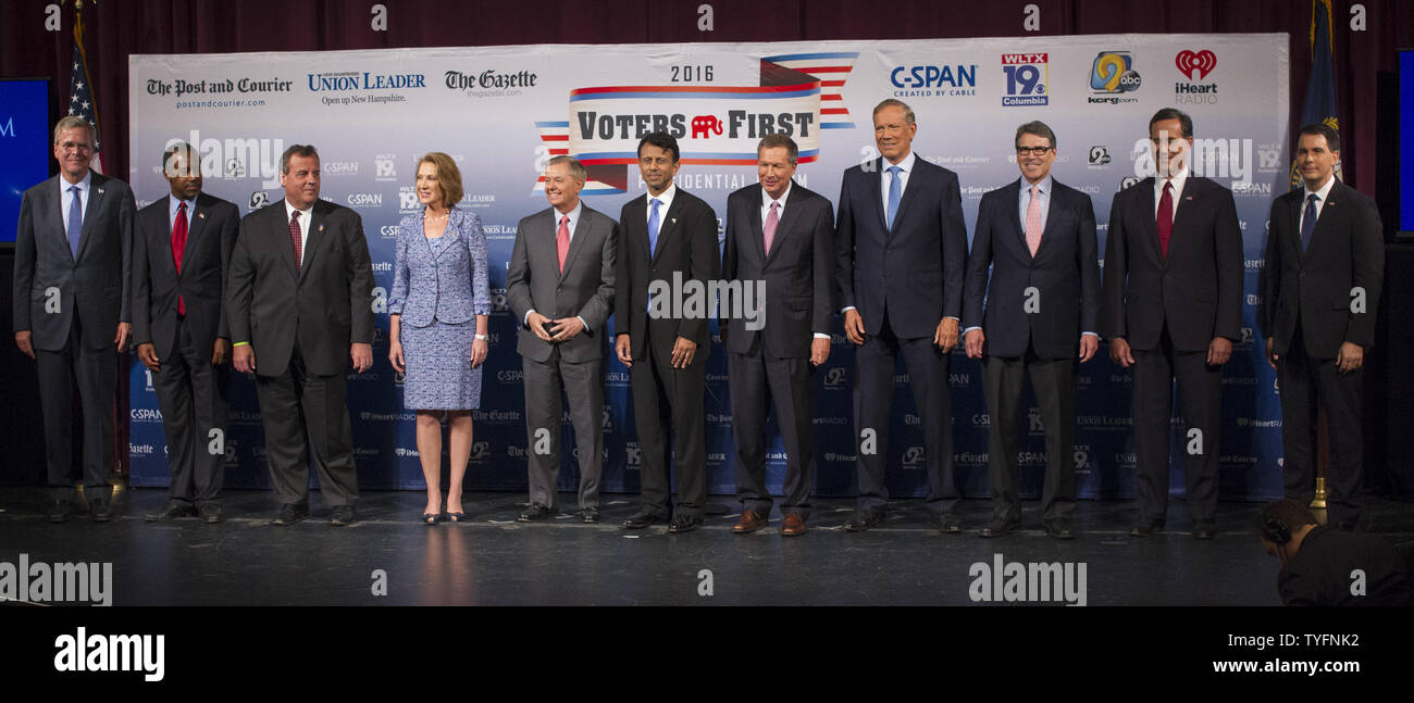 Republican presidential candidates, from left to right, Jeb Bush, Ben Carson, Gov. Chris Christie (R-NJ), Carly Fiorina, Sen. Lindsey Graham (R-NC), Gov. Bobby Jindal (R-LA), Gov. John Kasich (R-OH), George Pataki, Rick Perry, Rick Santorum and Gov. Scott Walker (R-WI), arrive on stage for the Voters First forum at St. Anselm College in Manchester, New Hampshire on August 3, 2015. Fourteen Republican presidential candidates, excluding Donald Trump, participated in the forum which kicked off the Presidential debate schedule for the 2016 presidential election. Photo by Matthew Healey/UPI Stock Photo
