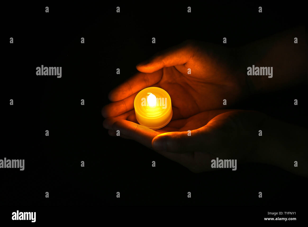 Hold the candle and pray Stock Photo Alamy