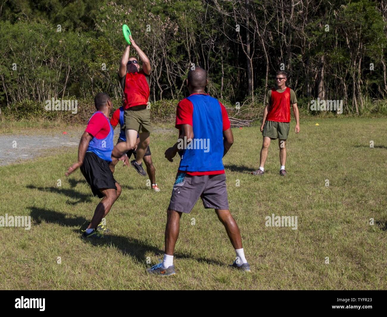 U.S. Marines with Combat Engineer Platoon, Task Force Koa Moana 16-4, play ultimate Frisbee with the Republic of Fiji Military Forces during Croix Du Sud in Plum, New Caledonia, Nov. 6, 2016. Croix Du Sud is a multi-national, humanitarian assistance disaster relief and non-combatant evacuation operation exercise conducted every two years to prepare nations in the event of a cyclone in the South Pacific. The Koa Moana exercise seeks to enhance senior military leader engagements between allied and partner nations in the Pacific with a collective interest in military-to-military relations. Stock Photo