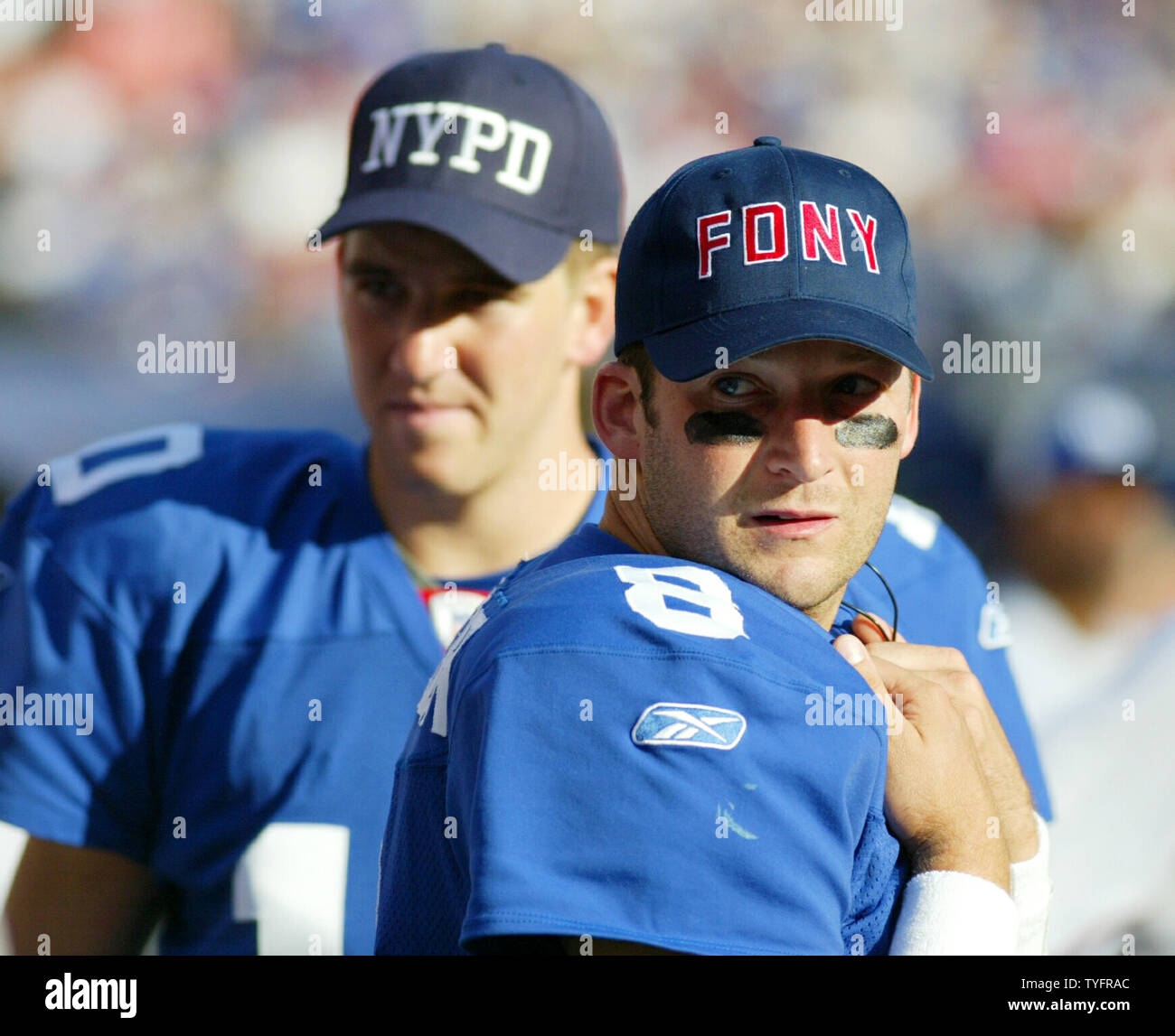New York Giants Eli Manning and back up quarterback Tim Hasselbeck wear  NYPD and FDNY hats on the sidelines. The New York Giants hosted the Arizona  Cardinals in week 1 at Giants