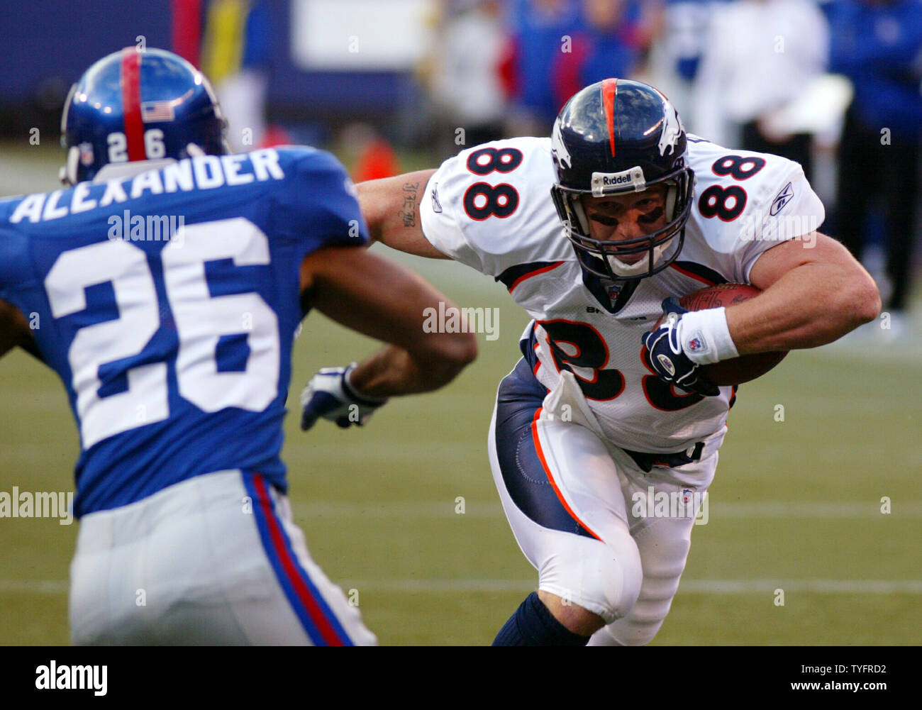 Denver Broncos Jeb Putzier lowers his shoulders before making contact with New  York Giants defender Brent Alexander. The New York Giants defeated the Denver  Broncos 24-23 in week 7 at Giants Stadium