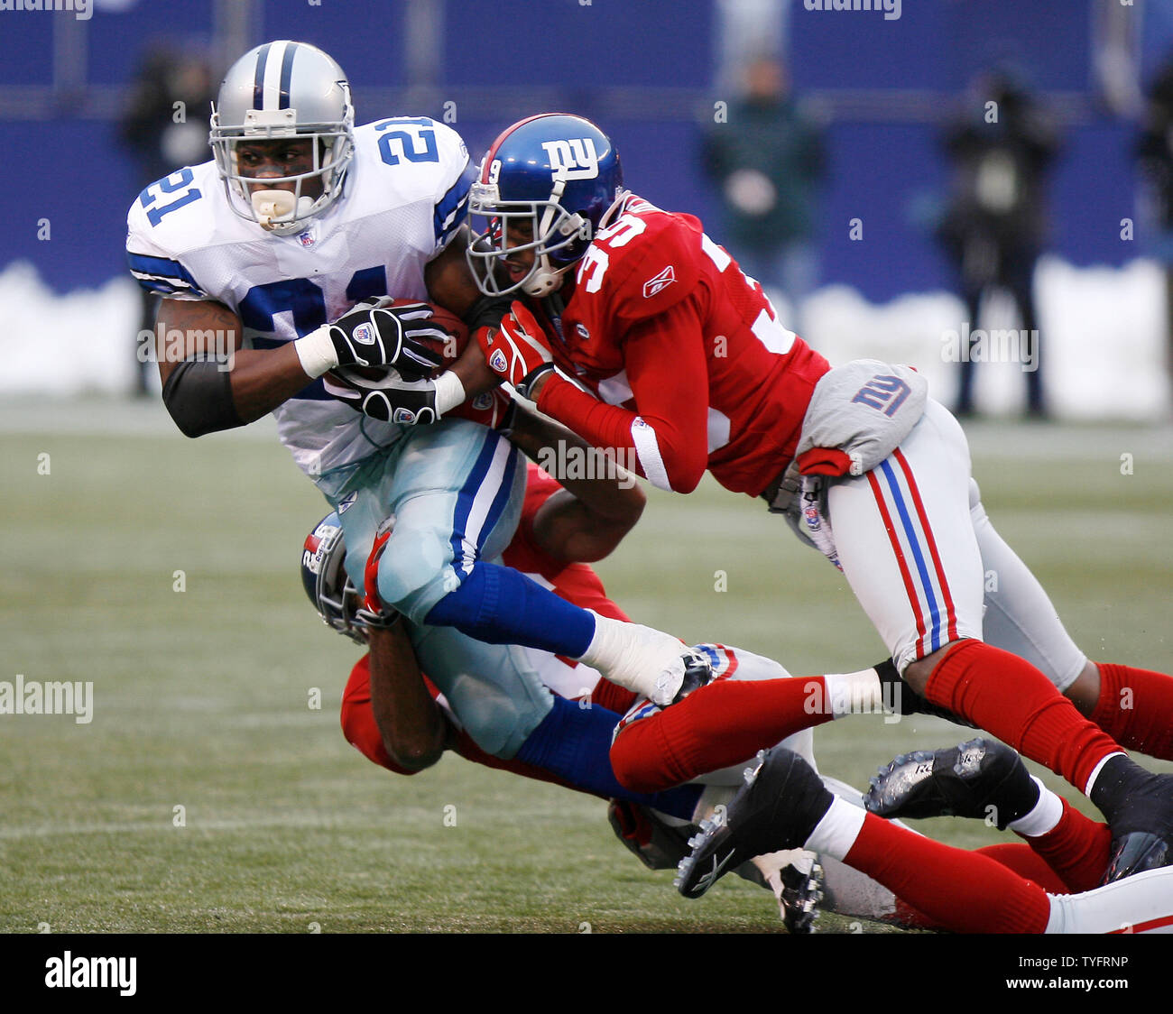 Dallas Cowboys running back Julius Jones gets hit by New York Giants  defender Curtis Deloatch in week 13 at Giants Stadium in East Rutherford,  New Jersey on December 4, 2005. The New