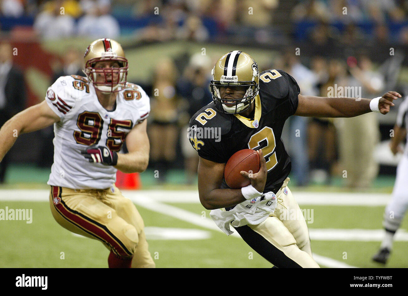New Orleans Saints quarterback Aaron Brooks is chased out of the