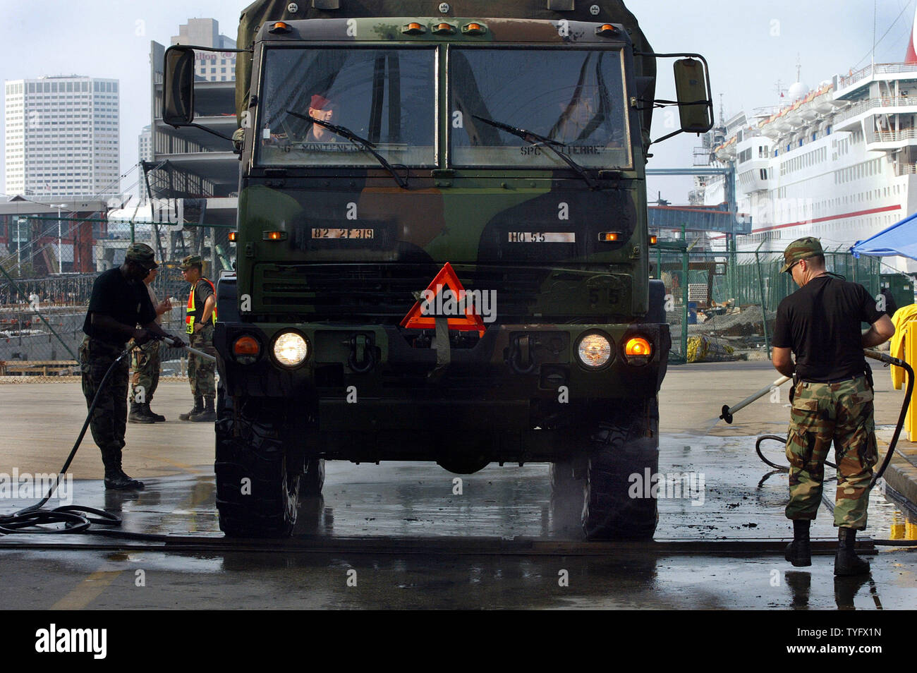 Members of the 149th Fighter Wing of the Texas Air National Guard, from Lackland AFB, Texas, perform field decontamination (decon) Sept. 18, 2005, in New Orleans on viecale that have been contamination by the murky flood waters left behind by Hurricane Katrina.  (UPI Photo/ A.J. Sisco) Stock Photo