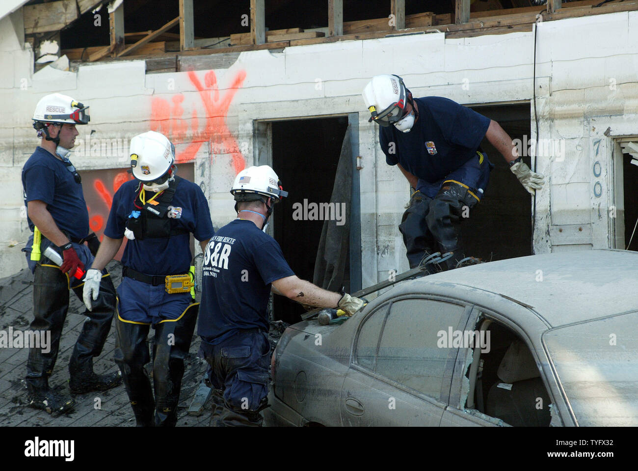 Lincoln County, Illinois fire department personnel search homes in the Lakeview section of New Orleans, Sept. 21, 2005, in the wake of Hurricane Katrina, which hit the city last month.   (UPI Photo/ A.J. Sisco) Stock Photo