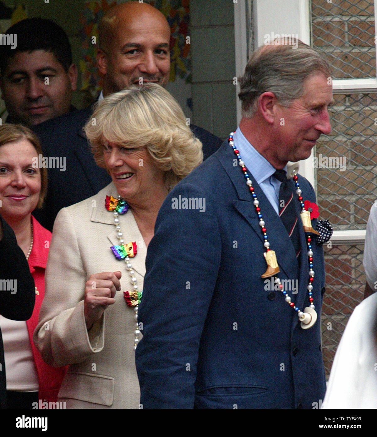 Britain's Prince Charles and his wife Camilla, Duchess of Cornwall, wearing Mardi Gras beads, visits Cathedral Academy in New Orleans' French Quarter Friday, November 4, 2005. Behind the duchess is New Orleans Mayor Ray Nagin. The Prince toured a neighborhood flooded by Hurricane Katrina and stopped by the small Catholic school, many of whose students transferred from other schools damaged in the flood. (UPI Photo/A.J. Sisco) Stock Photo