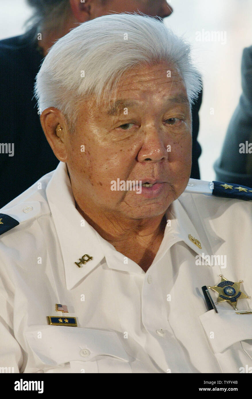 Jefferson Parish Sheriff Harry Lee listens as . Attorney General Alberto  Gonzales talks to the media during a press conference at the Port of New  Orleans after meeting with law enforcement officials