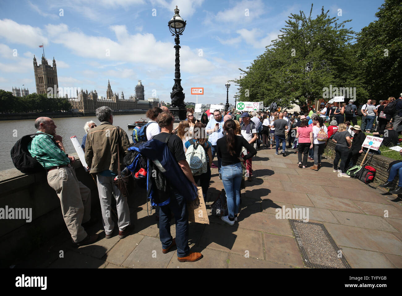 Climate activists gather on the Albert Embankment, adjacent to Lambeth Palace, as they make their way to join the lobby of Parliament on taking action on climate change and environmental protection in Parliament Square, Westminster, London. Stock Photo