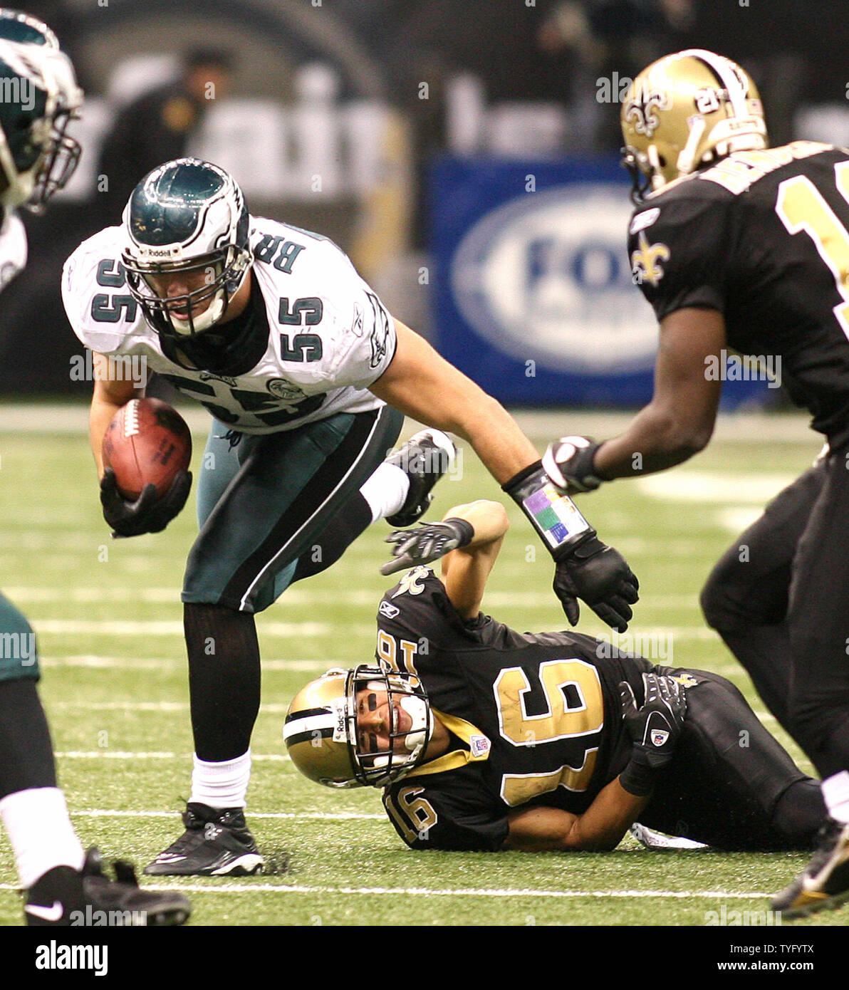 Seattle Seahawks corner back Marcus Trufant (23) reaches out for a low  tackle attempt of Philadelphia Eagles running back Correll Buckhalter (28)  during first quarter play at Philadelphia's Lincoln Field December 2