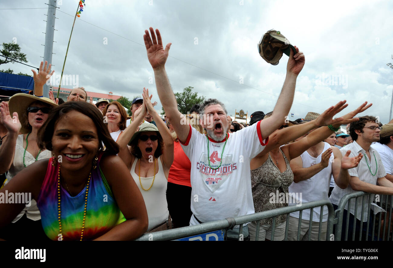 People cheer the Zydeco music in front of the Fais Do Do stage at the 2008 New Orleans Jazz and Heritage Festival in New Orleans on April 25, 2008. The Jazz Fest is a 10-day cultural feast in which thousands of musicians, cooks and craftspeople welcome 400,000 visitors each year.  (UPI Photo/Pat Benic) Stock Photo