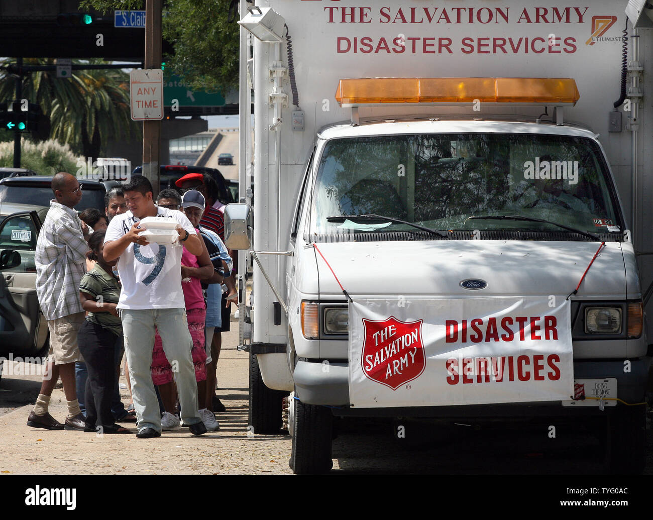 Residents line up for meals from a Salvation Army truck in downtown New