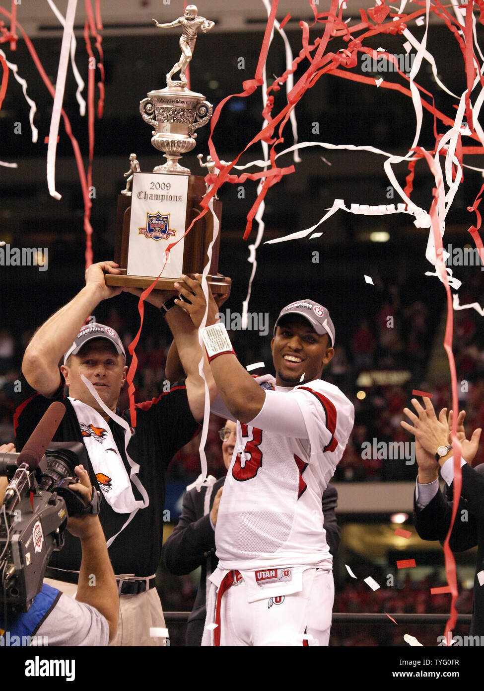 Utah's head coach Kyle Whittingham and quarterback Brian Johnson hoist the Allstate Sugar Bowl trophy aloft after winning against Alabama 31-17 in the Superdome in New Orleans on January 2, 2008.   (UPI Photo/Dave Fornell) Stock Photo