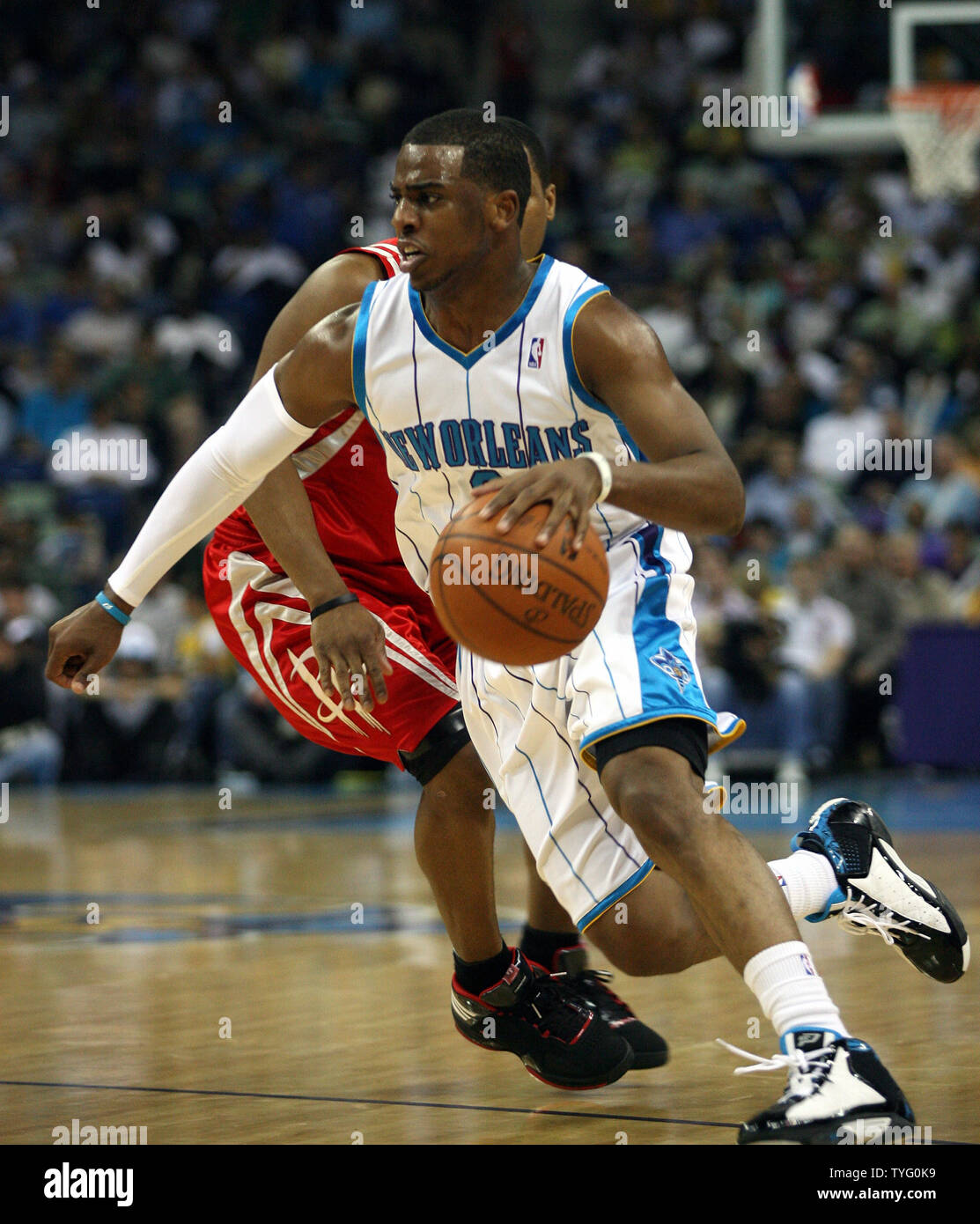 New Orleans Hornets guard Chris Paul brings the ball up the court ...