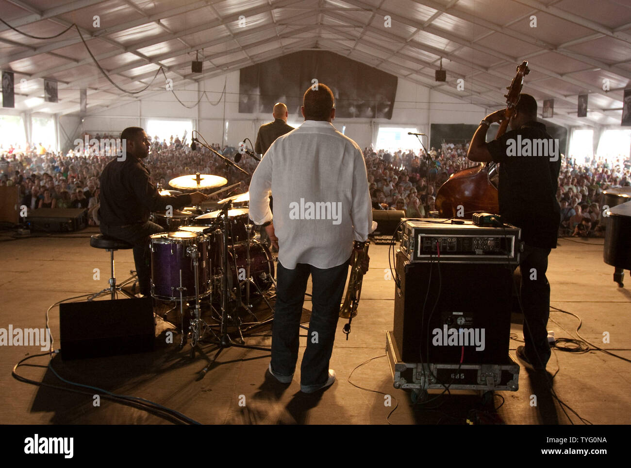 Grammy winner Terence Blanchard listens to his group play during his set in the WWOZ Jazz Tent at the New Orleans Jazz & Heritage Festival on April 26, 2009.  The 10-day festival sponsored by Shell attracts 400,000 people yearly.  (UPI Photo/Bevil Knapp) Stock Photo