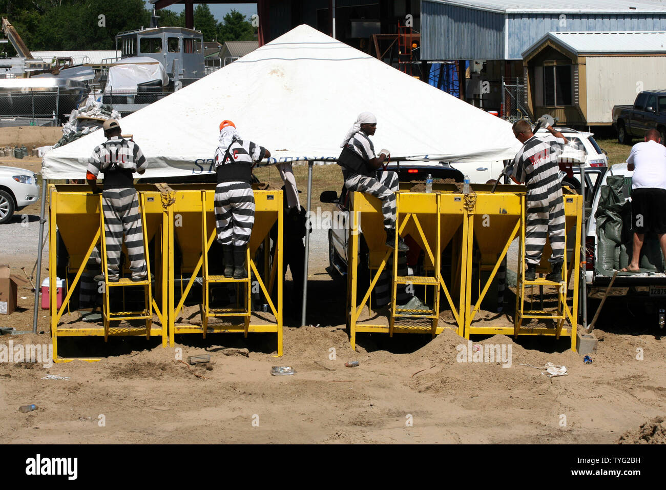 Prison inmates fill sandbags in Stephensville, Louisiana, May 14, 2011. St.  Mary Parish was preparing for high water after the U.S. Army Corps of Engineers opened the Morganza Floodway to divert water from the cresting Mississippi River away from downriver cities including Baton Rouge and New Orleans.    UPI/A.J. Sisco. Stock Photo
