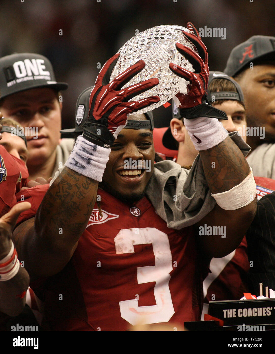 Alabama running back Trent Richardson (3) holds the BCS National  Championship trophy at the Mercedes-Benz Superdome in New Orleans,  Louisiana, on January 9, 2012. The Alabama Crimson Tide beat the LSU Tigers