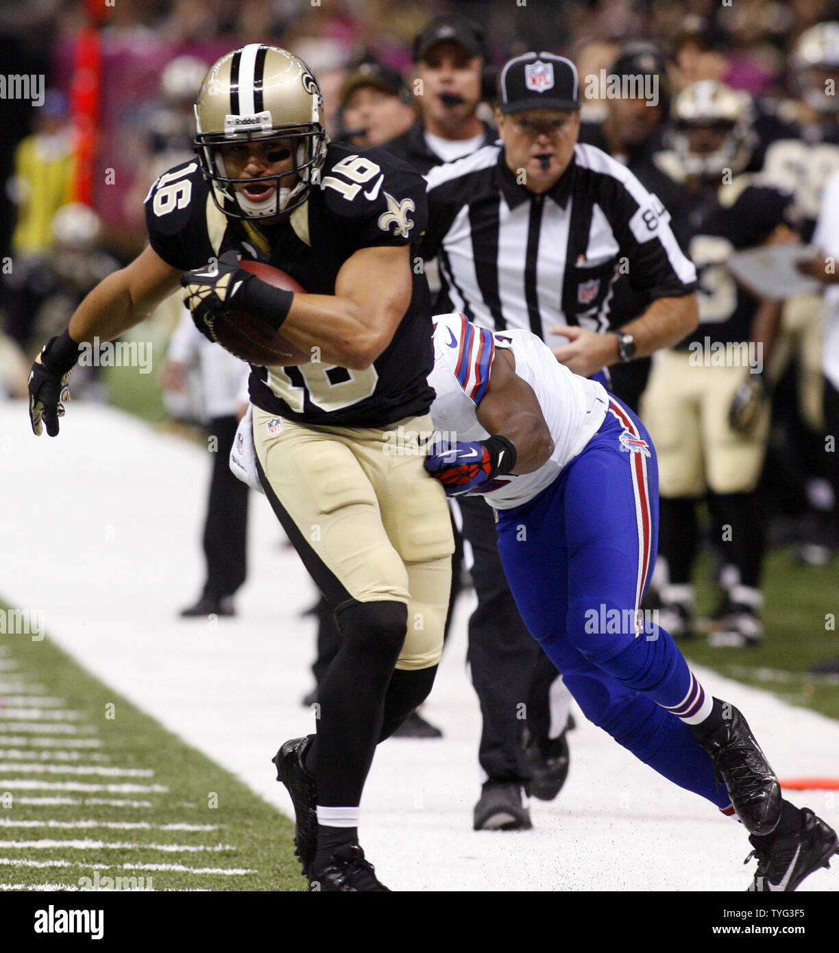New Orleans Saints wide receiver Lance Moore (16) picks up 9 yards on a Drew Brees pass before being pushed out of bounds by Buffalo Bills cornerback Leodis McKelvin (21) during the second quarter at the Mercedes-Benz Superdome in New Orleans, Louisiana on October 27, 2013.    UPI/A.J. Sisco Stock Photo