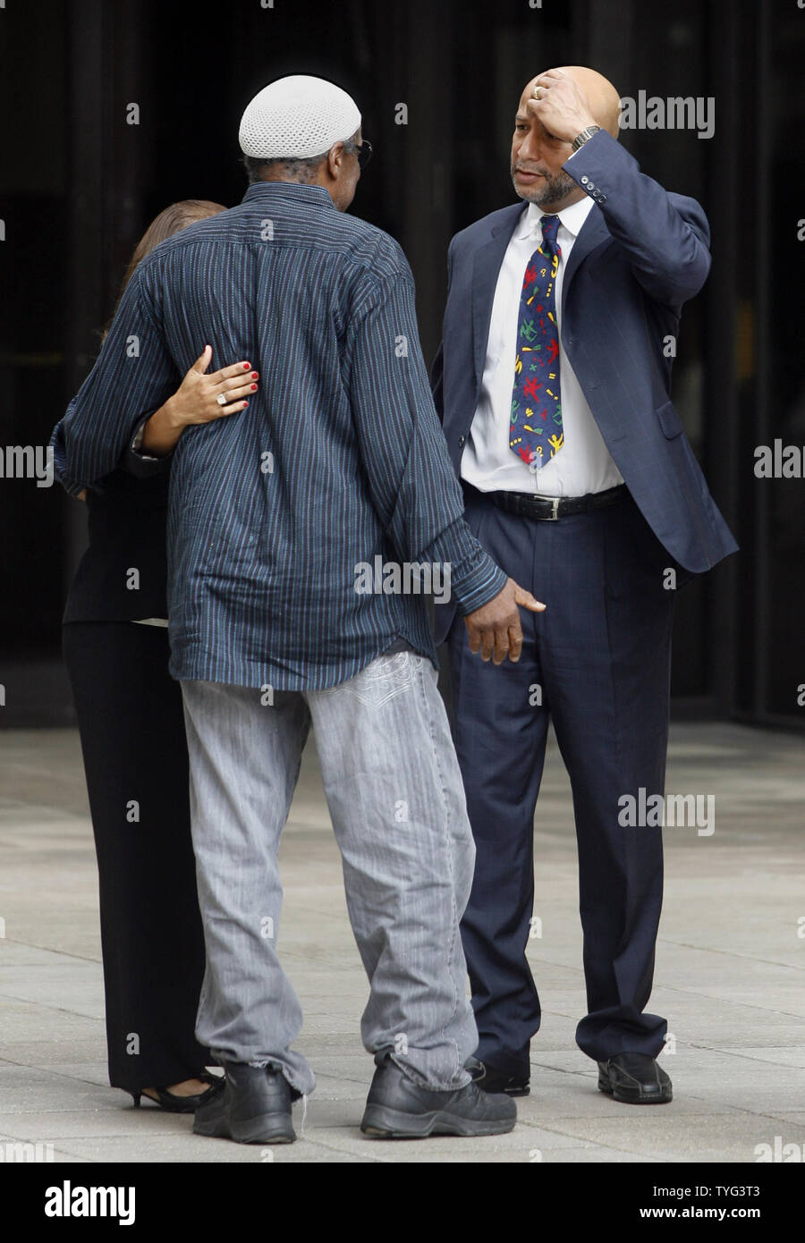 Former New Orleans mayor Ray Nagin (R) and his wife Seletha are greeted by Jerome Smith, a supporter and friend, after Nagin was sentenced to 10 years in Oakdale, Louisiana, a federal prison by U.S. District Judge Helen 'Ginger' Berrigan for fraud, bribery and related charges involving crimes that took place before and after Katrina devastated the city in August 2005. He was ordered to report to federal prison Sept. 8, and also pay restitution of $82,000.  UPI/A.J. Sisco Stock Photo