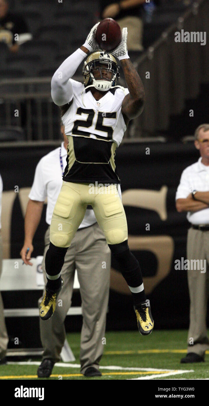 New Orleans Saints free safety Rafael Bush (25) catches a pass during pregame warmups at the Mercedes-Benz Superdome before the Saints - Titans contest, August 14, 2014.     UPI/A.J. Sisco Stock Photo