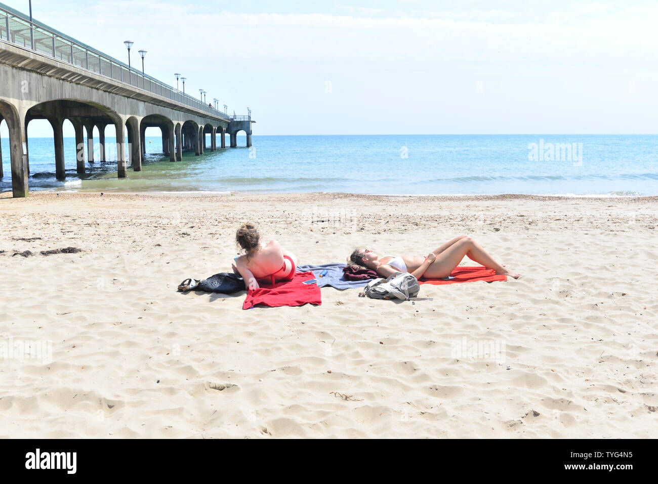 Girls sunbathing in bikinis hires stock photography and images Alamy
